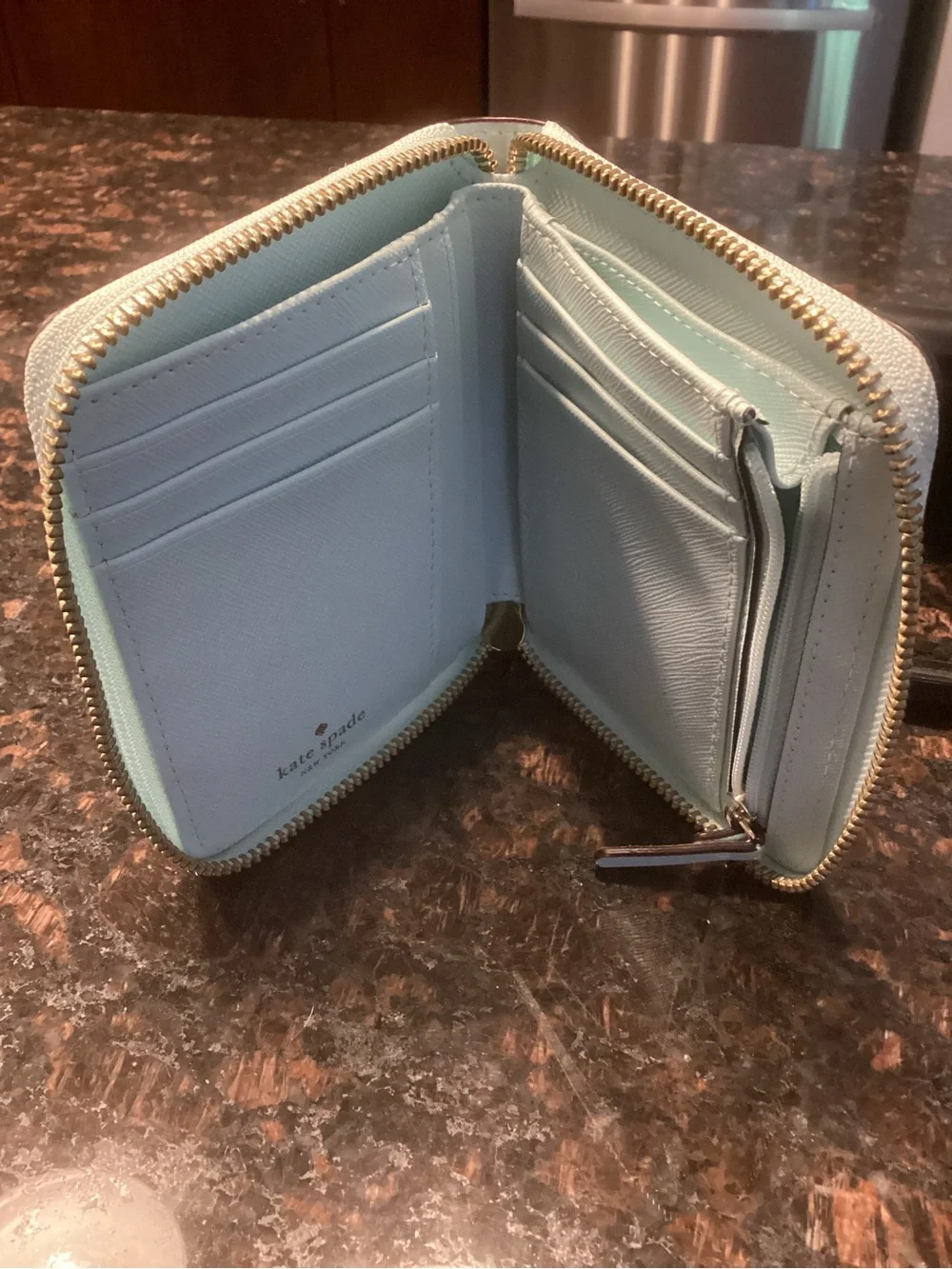 kate spade pale blue small flap wallet with gold plaque